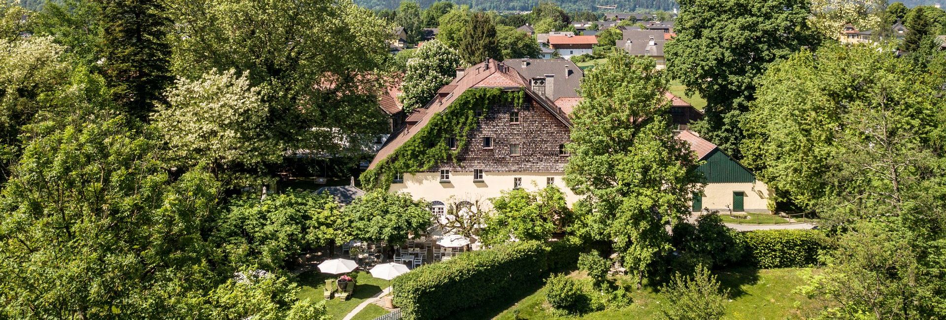 Air view of Schlosswirt zu Anif with garden near Salzburg