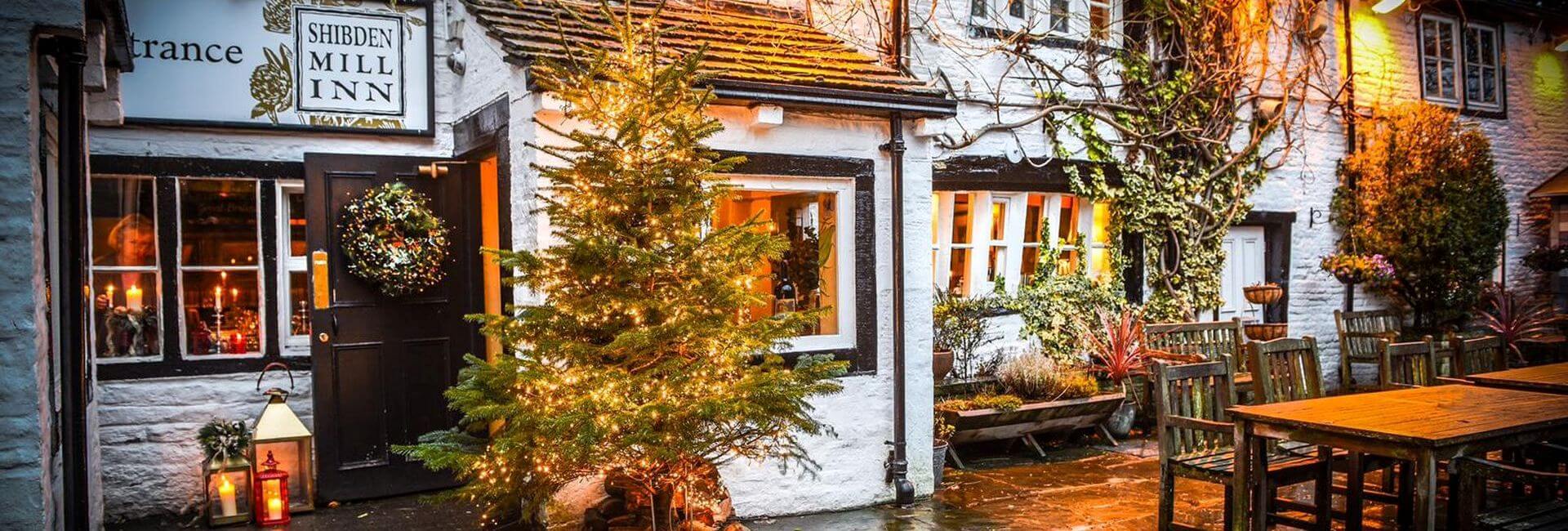 Entrance with Christmas tree in front of the Shibden Mill Inn