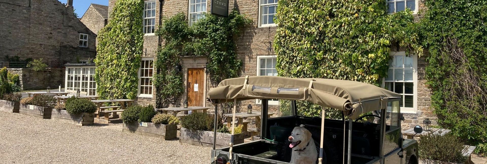 The Rose & Crown with dog in the car in Teesdale